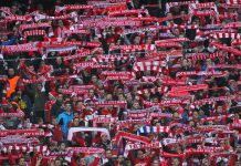 Bayern takes Rwanda deal in a new direction Fans of Bayern Munich holding up scarves