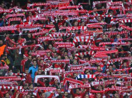 Bayern takes Rwanda deal in a new direction Fans of Bayern Munich holding up scarves