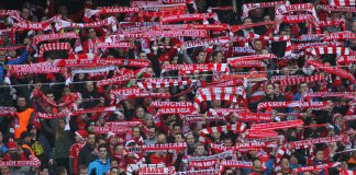 Bayern takes Rwanda deal in a new direction Fans of Bayern Munich holding up scarves