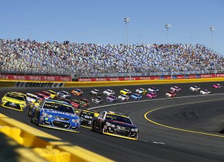 What NASCAR has had to cover up in Mexico Nascar race taking place with cars on the bend in the track