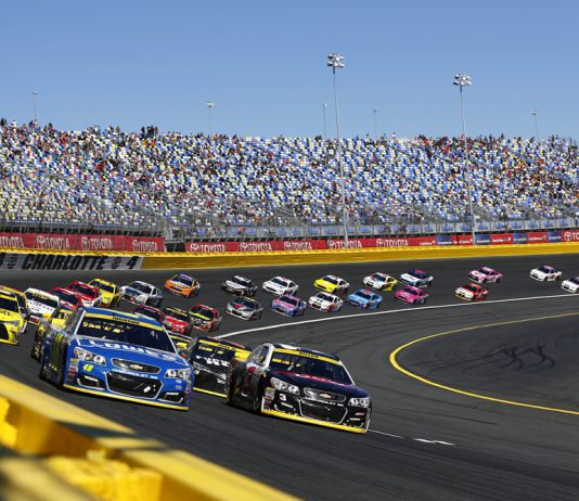 NASCAR settles charter lawsuit with Michael Jordan-backed 23XI Racing and Front Row Motorsports Nascar race taking place with cars on the bend in the track