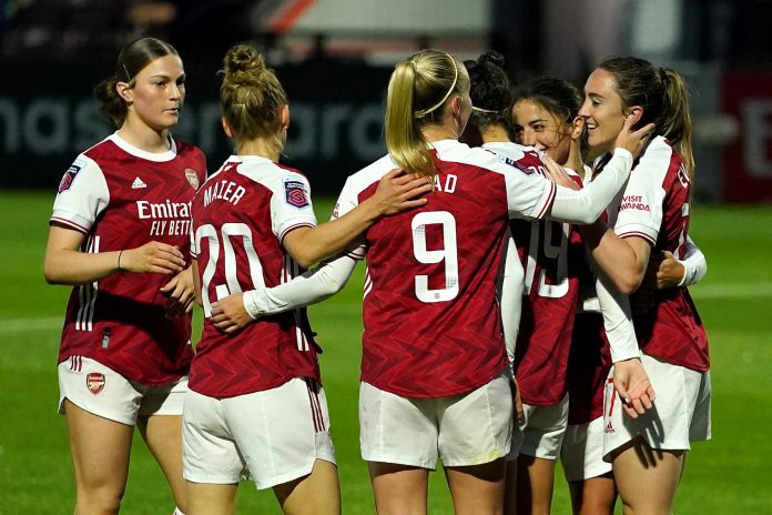 Arsenal women's team celebrating a goal.