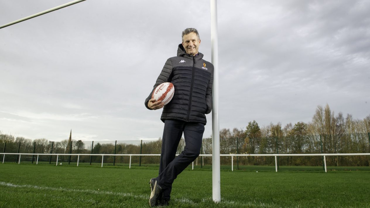 Adam Hills poses at Warrington's Victoria Park