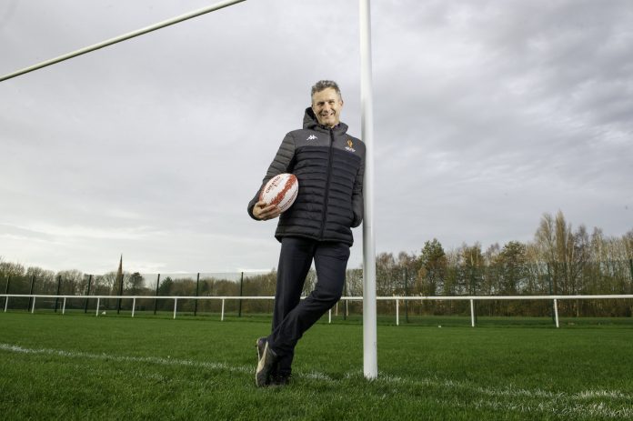 Adam Hills poses at Warrington's Victoria Park