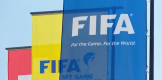 FIFA combats corruption in football with new UNODC campaign Flags hanging outside the FIFA headquarters in Zurich
