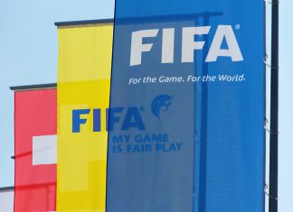 FIFA combats corruption in football with new UNODC campaign Flags hanging outside the FIFA headquarters in Zurich
