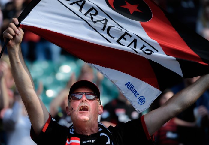 A Saracens supporter celebrates