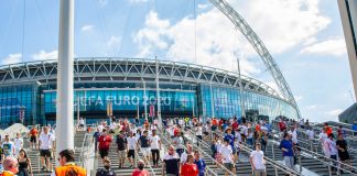 Betting ads cut by 47% during Euro 2020 from 2018 World Cup Fans walking outside of Wembley Stadium.