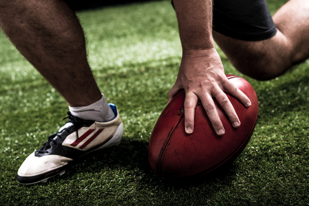 Football Trainer hand in a Pocket