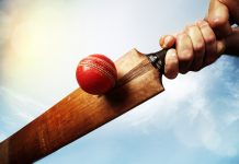 MLC hits for six securing Cognizant as title sponsor Cricket batsman hitting a ball shot from below against a blue sky.