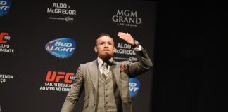 McGregor touches gloves with Tiger.Trade as its new ambassador