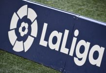 LaLiga free-to-air rights may be up for grabs for UK media La Liga logo on a sign on a football pitch.