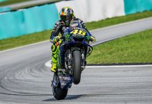 MotoGP unveils record 297,000 attendance for 2024 Michelin GP Bike pulling a wheelie at MotoGP track.