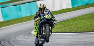 MotoGP unveils record 297,000 attendance for 2024 Michelin GP Bike pulling a wheelie at MotoGP track.