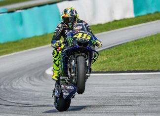 MotoGP coverage in India secured by Viacom18 Bike pulling a wheelie at MotoGP track.