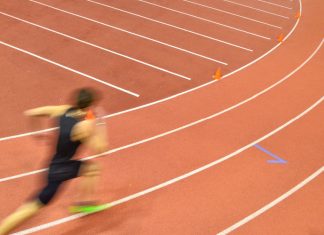 Michael Johnson’s track league partners with industry leaders Man running round track.