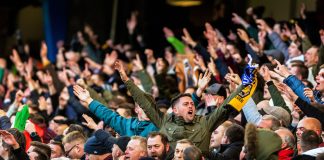 ‘This will protect the pyramid overall’ – Football Governance Bill passes second reading Fans singing at football game. FA Cup