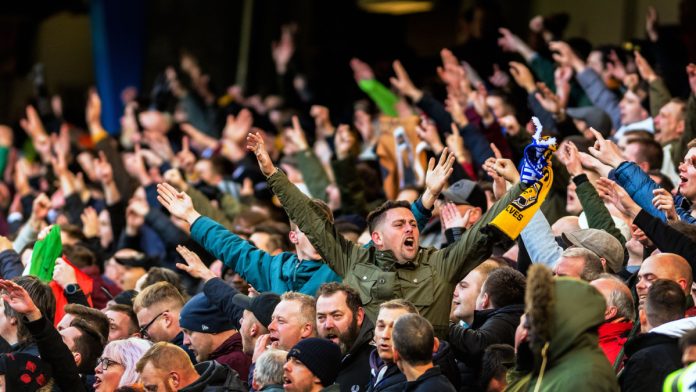 Fans singing at football game. FA Cup