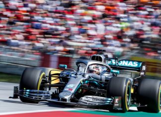F1 makes Lenovo a global partner in latest sponsorship shakeup F1 car driving on track.