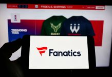 Fanatics renews contract with the Cleveland Browns Person holding a phone with the Fanatics logo in front of the company's website.