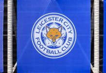 Leicester City FC faces up to £880k in CMA charges over competition law infringements September 12, 2021, Leicester, UK. Leicester City F.C. Football Club emblem against the backdrop of a modern stadium.