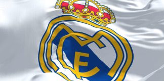 Carlo Ancelotti could face prison time over alleged tax fraud Real Madrid logo on a white flag.