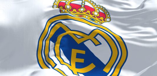 Real Madrid logo on a white flag.
