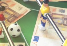 Spanish police arrest 53 in global sports betting fraud Euro notes on a foosball table.