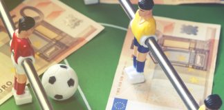 Spanish police arrest 53 in global sports betting fraud Euro notes on a foosball table.