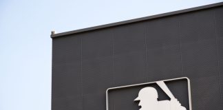 MLB invests in Jomboy Media to grow digital reach Image of the MLB logo on the side of a building