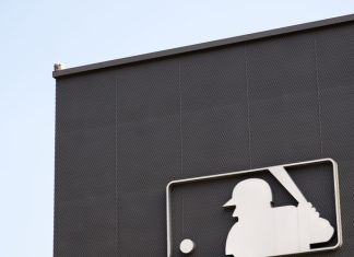 MLB invests in Jomboy Media to grow digital reach Image of the MLB logo on the side of a building