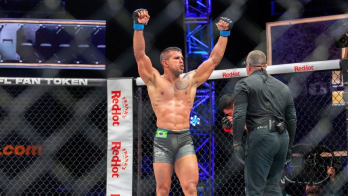PFL fighter raising his arms in celebration.