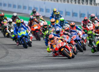 Liberty Media to rev up MotoGP in Dorna Sports acquisition Bikes racing on a track.