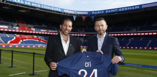 PSG announces trading partnership with CFI PSG and CFI holding up a football shirt to signify their new deal.