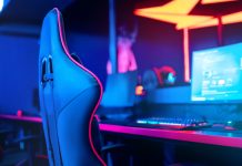 ESIC welcomes Kambi and Abios as anti-corruption supporters Esports chair in front of computer