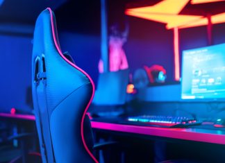 Monster Energy renews multi-year partnership with NSE Esports chair in front of computer