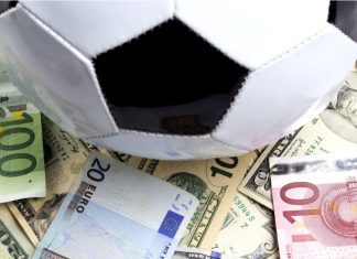 Spanish Footballers Association signs integrity partnership with DGOJ A football sat upon money (Euros)