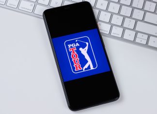 Disruption continues as the PGA and LIV Golf merger delayed until 2024 PGA phone on a desk