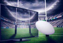 RLC announces 167 live games to be shown on SuperLeague+ Rugby ball positioned in front of TV and rugby sticks.