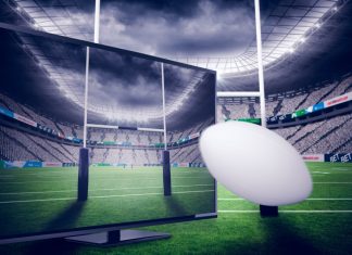 RLC announces 167 live games to be shown on SuperLeague+ Rugby ball positioned in front of TV and rugby sticks.