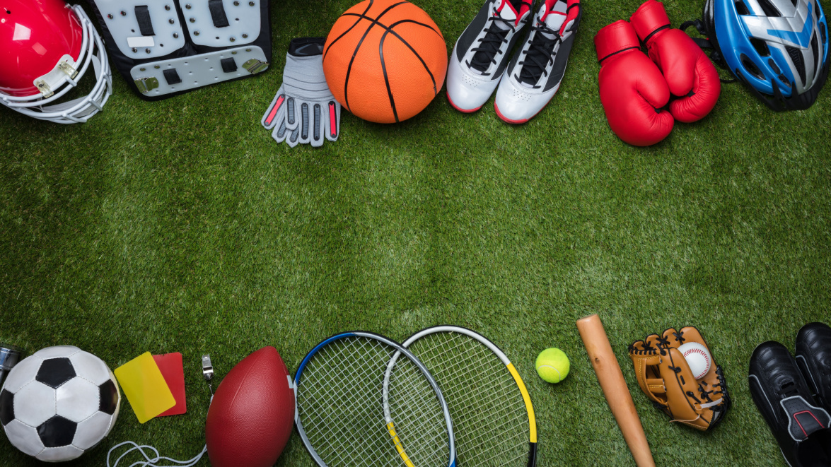 A range of sporting equipment on grass.