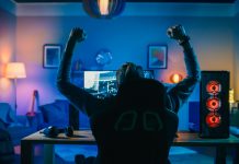 Dafabet eyes up skyrocketing esports industry with Oddin.gg Backshot of a gamer celebrating.