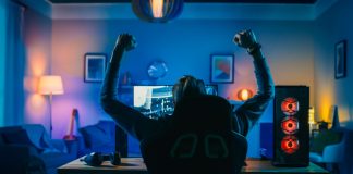 SteelSeries to boost BUEC with premium gaming gear Backshot of a gamer celebrating.