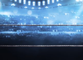 DAZN set to host ‘Knockout Chaos’ live worldwide Boxing arena with blurred spectator and stadium light