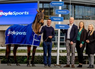 Vlad Kaltenieks: Cementing BoyleSports’ legacy via Ireland’s greatest race BoyleSports' representatives standing with a horse in a branded cover.