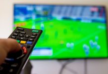 World Rugby and CBS Sports agree broadcast deal through 2029 Close up shot of man watching a rugby game.