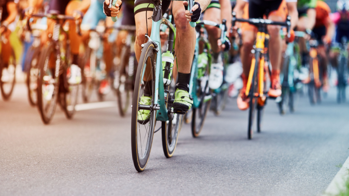 A large group of cyclists on the road.