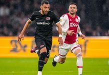 AFC Ajax suspends CEO over insider trading allegations Two Dutch Eredivisie player's playing football.
