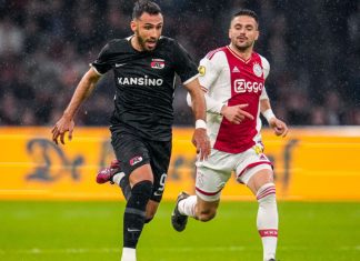 AFC Ajax suspends CEO over insider trading allegations Two Dutch Eredivisie player's playing football.