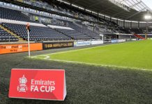 The FA & TNT Sports sign a landmark broadcasting deal A sign that says "Emirates FA Cup" on the pitch at Hull.